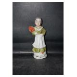 Figurine of Older Lady w/Green Dress Holding Roses