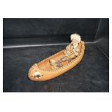 American Indian in a Canoe Figurine