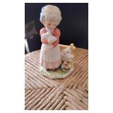 Young Lady Holding a Rabbit Figurine