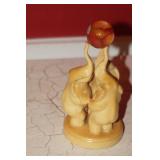 Three Elephants Holing a Marble