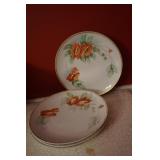 Four Plates with an Orange Flower Motif
