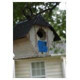 White Bird House with Black Roof in Tree
