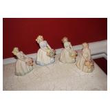 Collection of 4 Porcelain Girls Holding Flowers