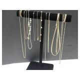 Collection of Necklaces on Display Stand