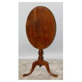 A 19TH CENTURY MAHOGANY OVAL TILT-TOP TABLE