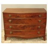 A 20TH CENTURY AMERICAN BOW FRONT CHEST WITH INLAY