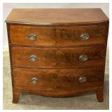 A 19TH C. ENGLISH SOLID MAHOGANY BOW-FRONT CHEST