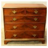 A 19TH CENTURY AMERICAN CHEST IN FLAMED MAHOGANY