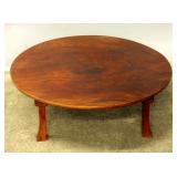 A JAPANESE KEYAKI ROUND TABLE WITH FOLDING LEGS