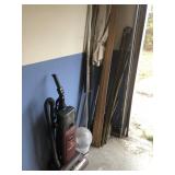 Contents of Corner - Vacuum, Umbrella, Etc