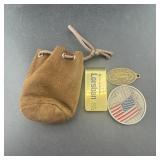 Leather coin bag with money clip and tokens