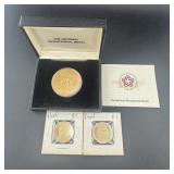 Commemorative gold-plated dollar and other coins