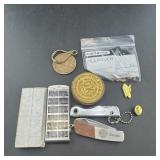 Miscellaneous junk drawer items, pocket knives, an