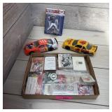 Flat of multiple sports cards, collectibles, pins,