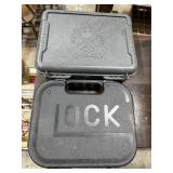 Pistol Cases; Two poly pistol storage cases.