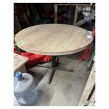 Round Table; 42" wide round top with metal base.