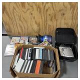 Assortment of DVDs including an Insignia portable