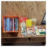 Assortment of coloring books and books