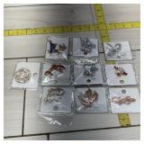 Lot of 10 mint brooches
