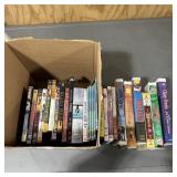 Assortment of VHS tapes and DVDs; see photos for t
