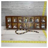 Fourteen-piece Stations of the Cross display with