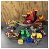 Assortment of toys including pirate ship, NASCAR c