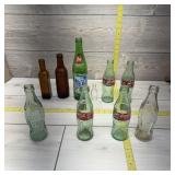 Assorted collectible Coke bottles, 1976 Lake Cryst