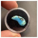 Polished turquoise stone, in case