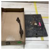 Metal Hardware. Flat metal anvil and cast iron sto