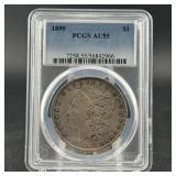 1899 Morgan Silver Dollar; Graded Pcgs Au55; Certi