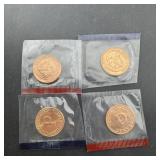 Four uncirculated treasury pennies, P and D mint m