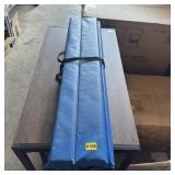 Roll-out floor pad measuring approximately 36 x 48