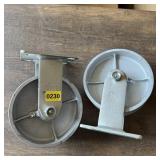 Two 5-inch cast iron caster wheels. See photos.