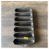 Cast iron cornbread pan with glass candy dish. See
