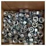 Large lot of 5/8-inch nuts. See photos.
