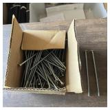 Box of approximately 7-inch-long 1/4-inch bolts. S