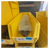 Metal Nuts in Plastic Storage Bin