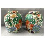 (2) Porcelain ginger jars featuring a vibrant,