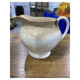 White pitcher, green planter