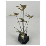Brass Birds On Volcanic Rock