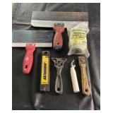 Assorted drywall and painting tools including two