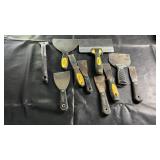 Assorted drywall scrapers including multiple