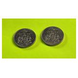 Two Canadian fifty-cent coins dated 1969 and