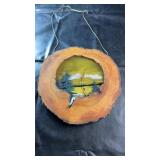 Natural wood slice wall hanging featuring a resin