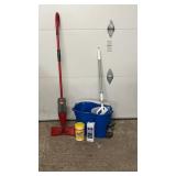 Assorted household cleaning supplies including a