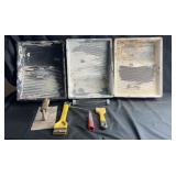 Assorted painting and drywall tools including