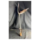 Classic shooting stick featuring a sturdy metal