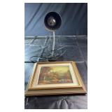 A metal desk lamp with adjustable gooseneck stem