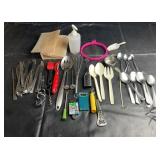 Assorted kitchen utensils and flatware