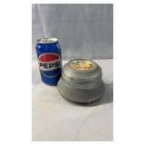 Early 1900s trinket music box featuring a round